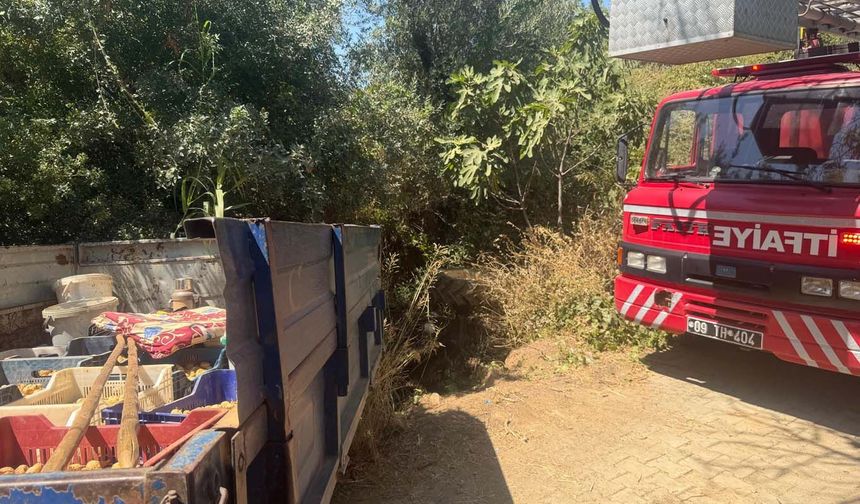 Devrilen traktörün altındaki sürücüyü itfaiye ekipleri kurtardı